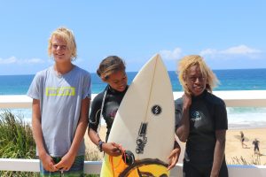 Solwata Sista team members and school student who donated his board at Surfest